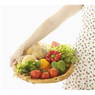 Woman with basket of fruits, vegetables, and bread